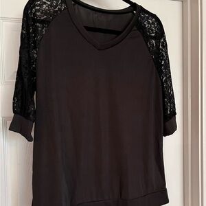 NWOT black top with lace sleeves.  Size xl boutique top